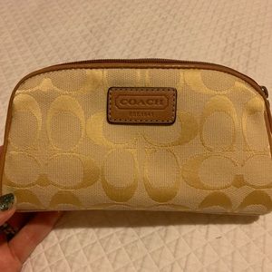 Butter yellow COACH makeup bag